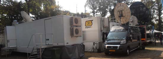 Tv Compound Monza, Italy. Uplink & production trucks with in front the Black Uplink-Van.